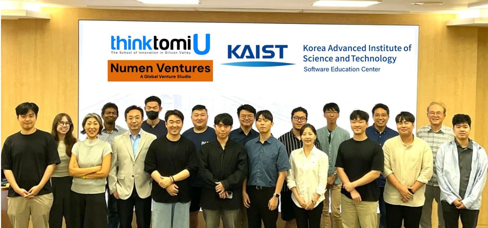 A KAIST Software Education Center cohort standing in front of a screen carrying the thinktomiU, Numen Ventures and KAIST marks.