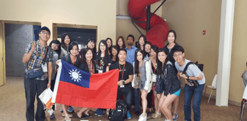 A programme cohort in Taiwan holding the Taiwanese flag.